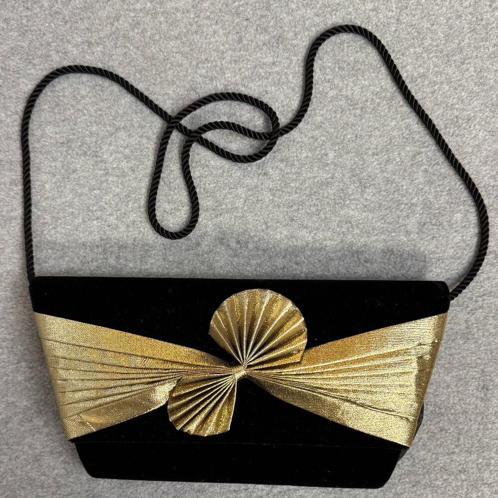 Ladies evening clutch/ bag. Black with gold bow accent.